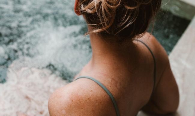 woman sitting in hot tub